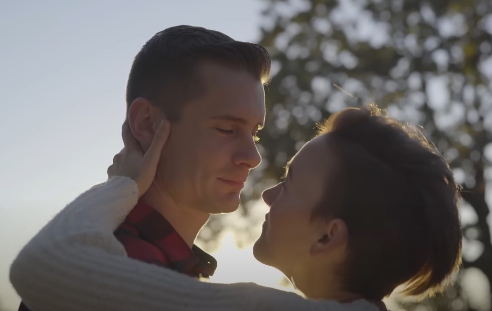 Two men kissing